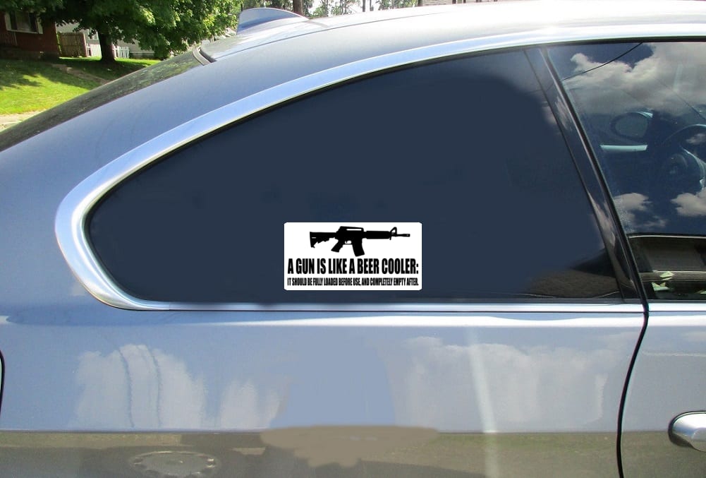 A Gun Is Like A Beer Cooler Car Sticker shown on a vehicle rear window