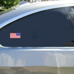 American Flag Car Sticker shown on a vehicle rear window