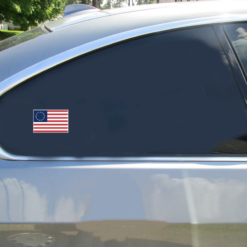 Betsy Ross Flag Car Sticker shown on a vehicle rear window