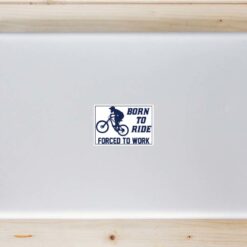 Born To Ride Forced To Work MTB Laptop Sticker shown on a laptop lid