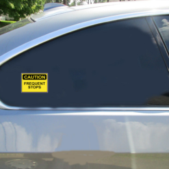 Caution Frequent Stops Car Sticker shown on a vehicle rear window