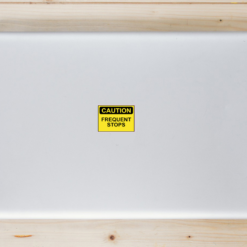 Caution Frequent Stops Laptop Sticker shown on a laptop lid