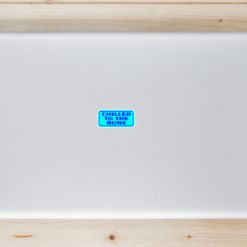 Chilled To The Bone Laptop Sticker shown on a laptop lid