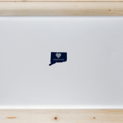 Connecticut Heart State Shaped Laptop Sticker shown on a laptop lid