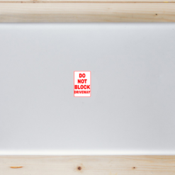 Do Not Block Driveway Laptop Sticker shown on a laptop lid