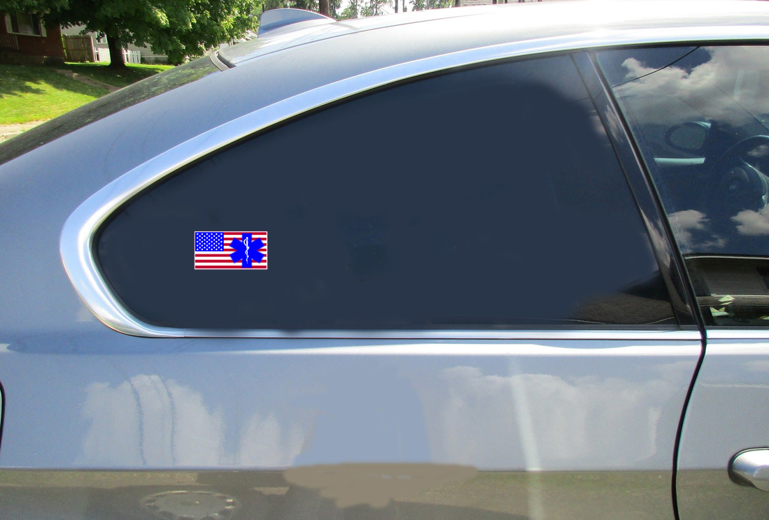 EMS American Flag Car Sticker shown on a vehicle rear window