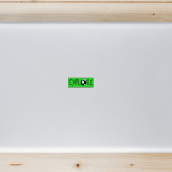 Explore Earth Laptop Sticker shown on a laptop lid