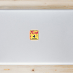 Hawaii Surfer Sunset Laptop Sticker shown on a laptop lid