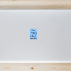 Hooker On The Weekends Fishing Laptop Sticker shown on a laptop lid