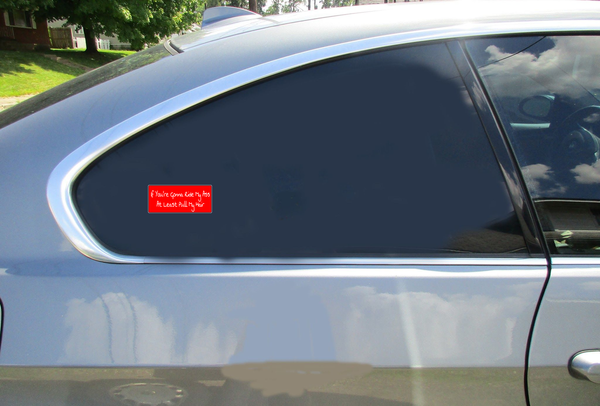 If You're Gonna Ride My Ass At Least Pull My Hair Car Sticker shown on a vehicle rear window