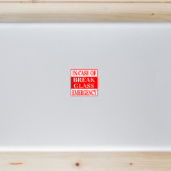 In Case Of Emergency Break Glass Laptop Sticker shown on a laptop lid