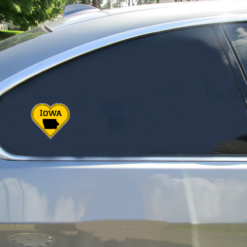 Iowa Black Gold Heart Shaped Car Sticker shown on a vehicle rear window