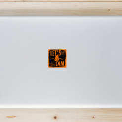 Lets Jam Guitar Player Laptop Sticker shown on a laptop lid