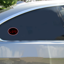 Love Guns Car Sticker shown on a vehicle rear window