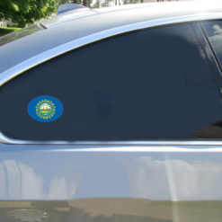 New Hampshire Flag Oval Car Sticker shown on a vehicle rear window