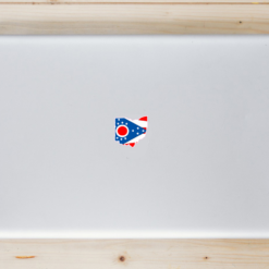 Ohio Flag State Shaped Laptop Sticker shown on a laptop lid