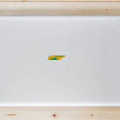 Pigeon Forge Tennessee State Shaped Laptop Sticker shown on a laptop lid