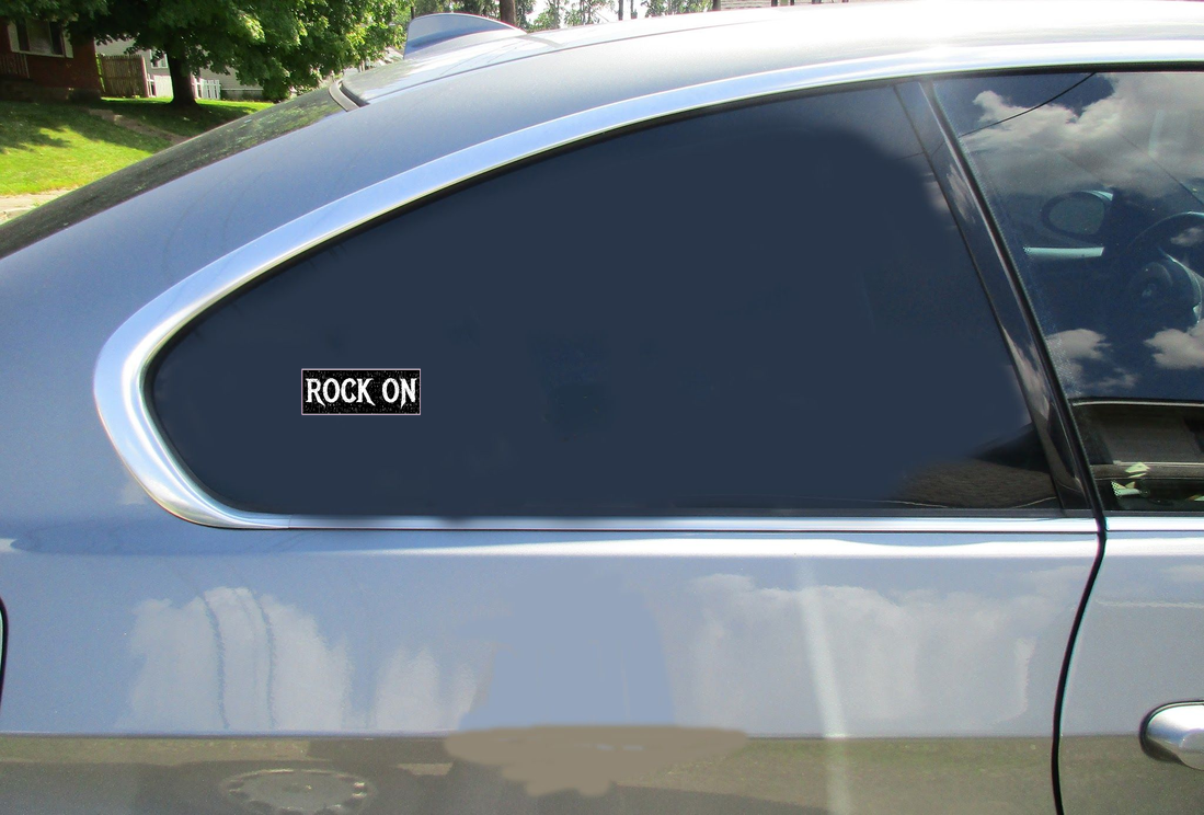 Rock On Black Distressed Car Sticker shown on a vehicle rear window