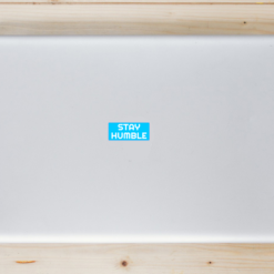 Stay Humble Laptop Sticker shown on a laptop lid