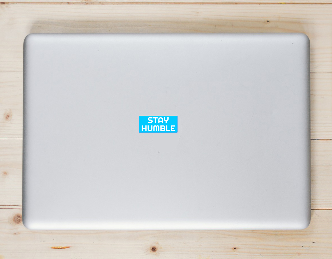 Stay Humble Laptop Sticker shown on a laptop lid