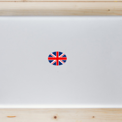 Union Jack Flag Oval Laptop Sticker shown on a laptop lid