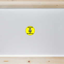 Watch For Motorcycles Yellow Circle Laptop Sticker shown on a laptop lid