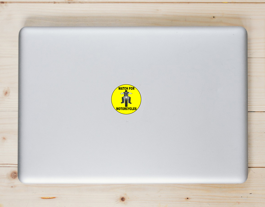 Watch For Motorcycles Yellow Circle Laptop Sticker shown on a laptop lid