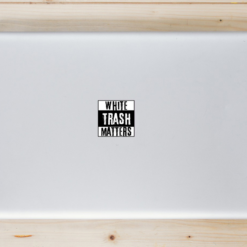White Trash Matters Laptop Sticker shown on a laptop lid